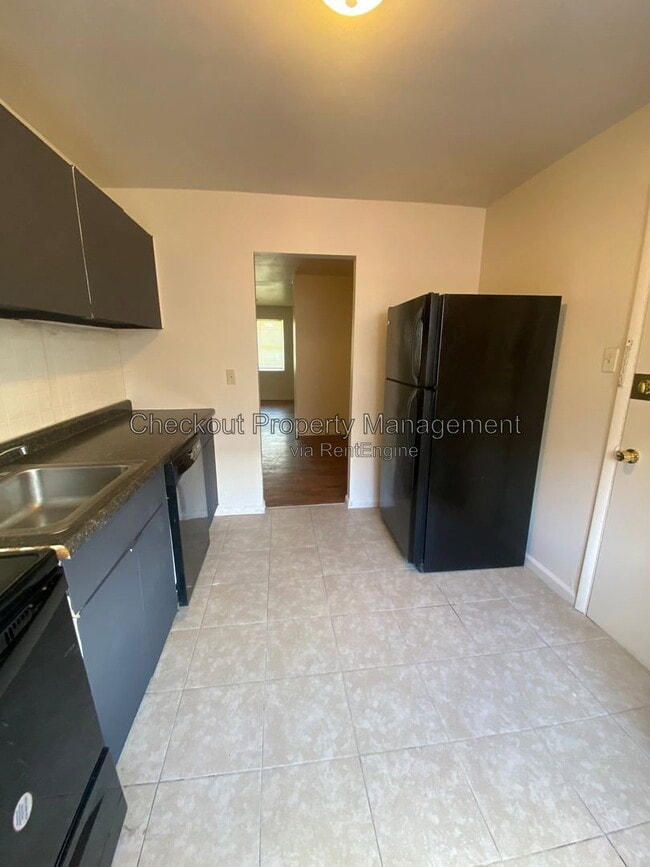 Building Photo - 9973 Sloane Square Unit D
