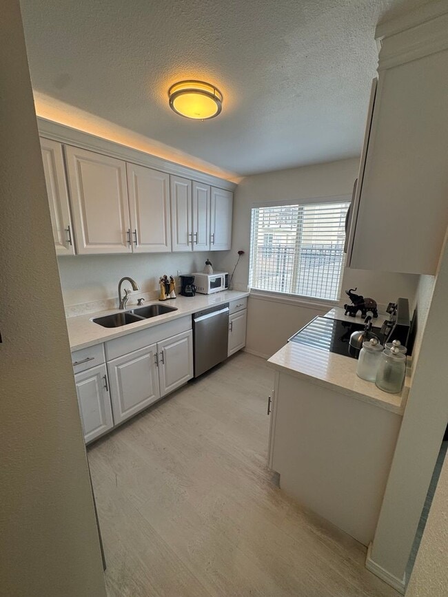 Photo - Gorgeous Condo in Seward Park with 2 Parking Spaces, Steps Away from Pool with Water View! Unit 203