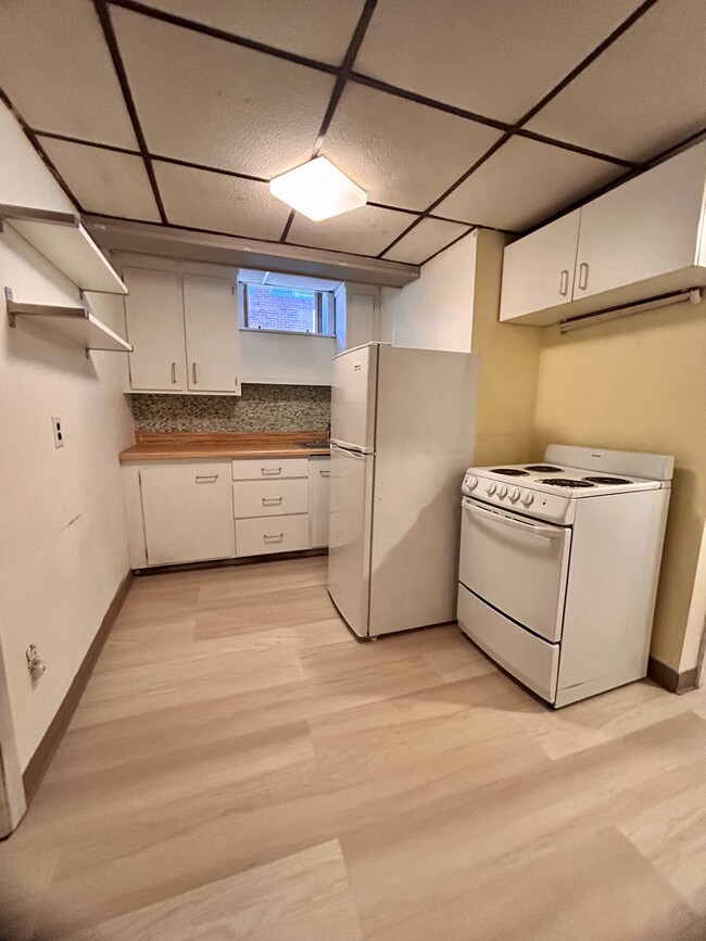 Kitchen with electric stove, fridge - 397 Boylston St Apartments Unit 3