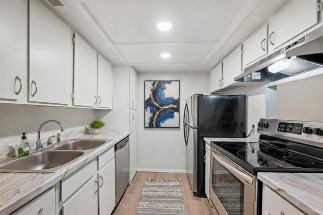 Photo - Updated 1 Bed Condo | Reserved Parking, Covered Patio & Fireplace Unit 129