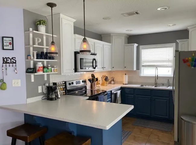 Photo - Stylish 3BR Home with Open Layout, Screened Porch & Fenced Yard