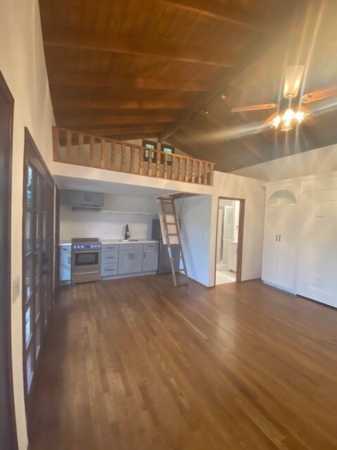 Charming hard wood floors, vaulted wood ceilings and loft