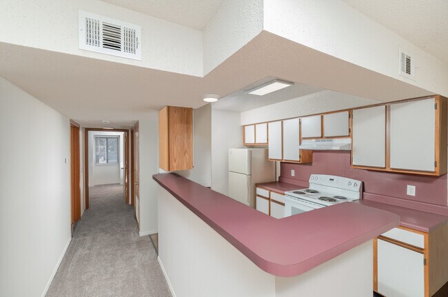 Kitchen with Breakfast Bar and Hallway