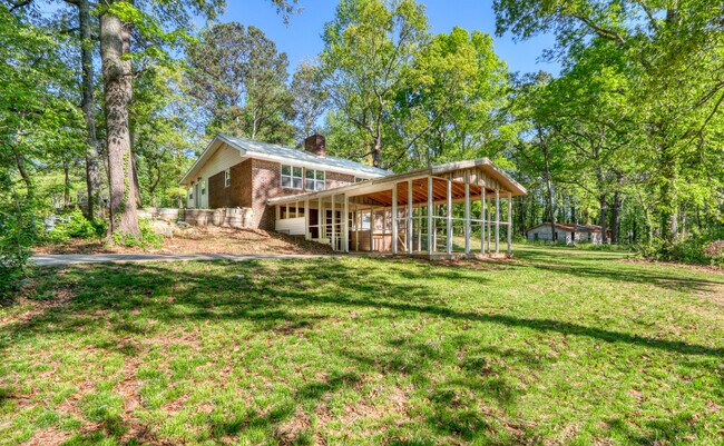 Second driveway with carport (park your boat or truck) / extended patio - 6038 Old Bascomb Rd
