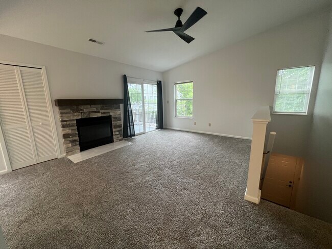 Wood burning fireplace features new stone surround, new tile hearth and new stone mantle. - 2402 Stoney Run Trl Unit 2402