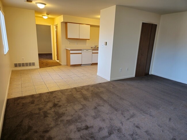 Living Rm to Dining Rm - Flora Woods Apartments