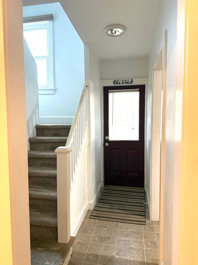 Front Door/Stairwell - 74 Pleasant St Unit 2 Bed 1 Bath Apartment