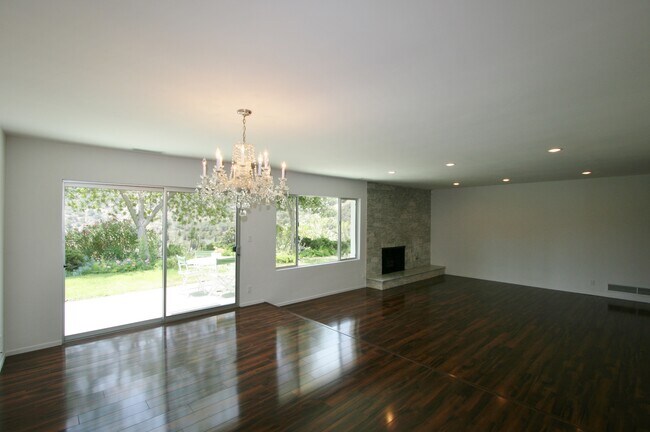 Formal Dining with Chandelier and view of backyard - 2657 Zorada Dr