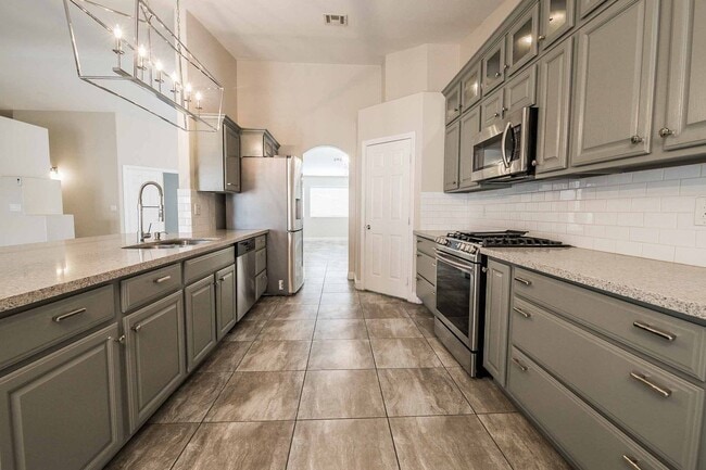 Photo - STUNNING 3 Bedroom Home with a 3 CAR GARAGE & RV PARKING!