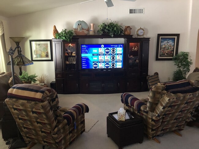 Living Room. 1,000's of tv channels on IPTV system. - 9513 E Champagne Dr