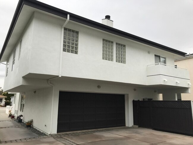 Rear/garage, backyard fence and patio + master bedroom balcony - 2108A Ernest Ave