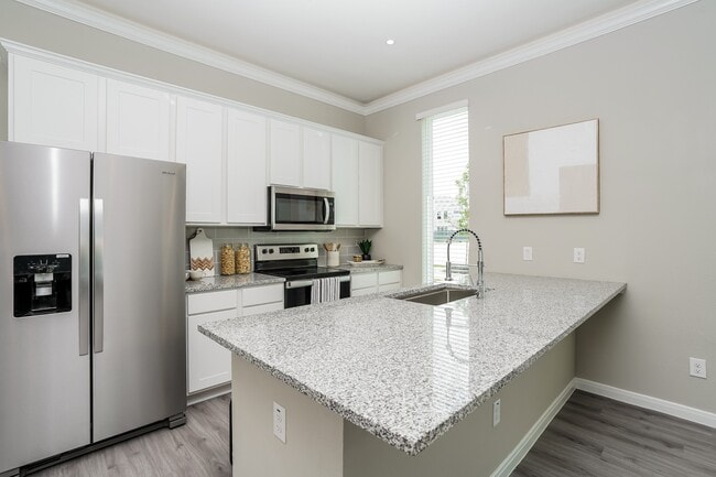 Kitchen with Stainless Steel Appliances - The Reserve at Red Oak