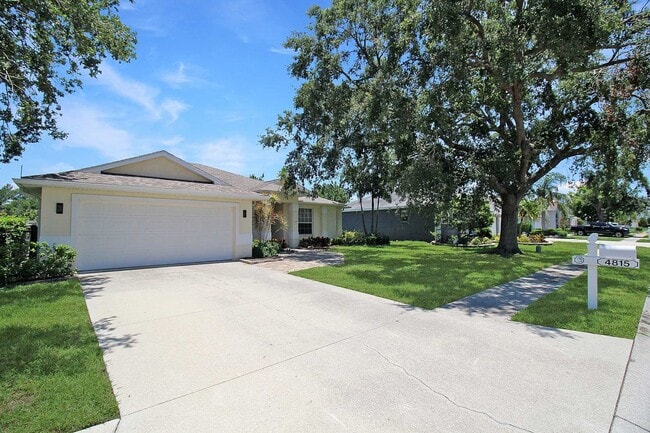 Photo - Annual rental: Spacious 3BR/2BA Creekwood Home with Office, Screened Lanai, EV Charger & Resort-S...