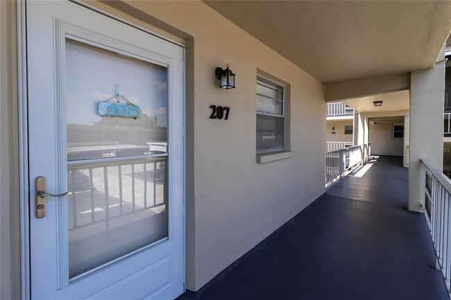 Building Photo - 9940 47th Ave N Unit 207