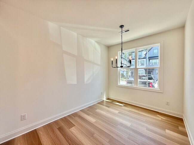 Photo - **OFFERING $125 RENT DISCOUNT FOR FIRST 6 MONTHS** Newly Built 4BD, 3.5BA Raleigh Townhome in a G...