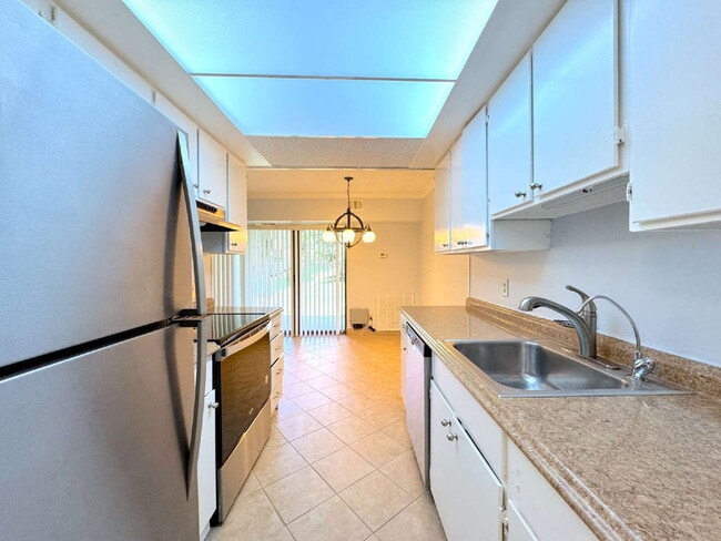 Photo - Welcome to this beautifully maintained first-floor condominium offering 2 bedrooms and 2 full bat... Unidad 1B