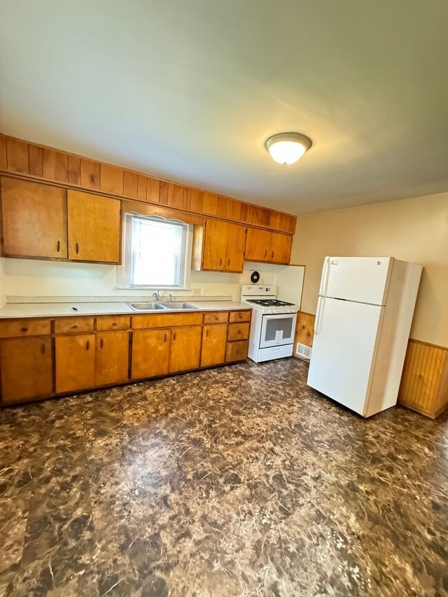 Photo - Charming 3-Bedroom, 1-Bathroom Home with Garage – $1,350/Month | Accepting Section 8