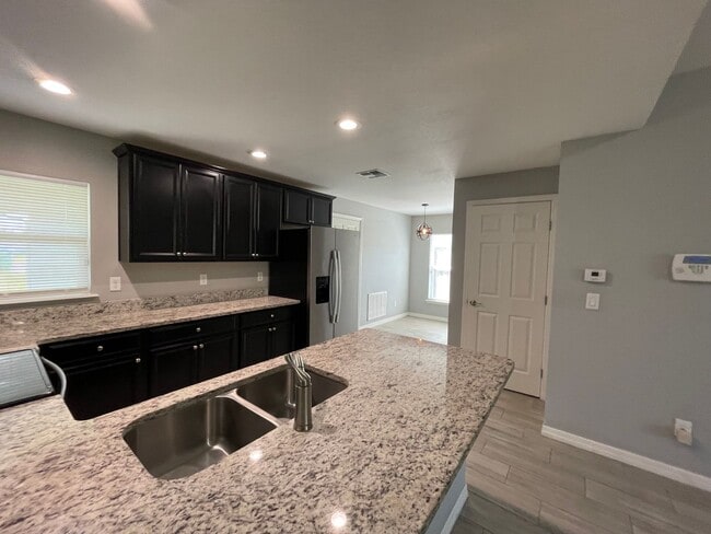 Photo - Modern 3-Bedroom Home with Office & Spacious Yard in Deltona Lakes!