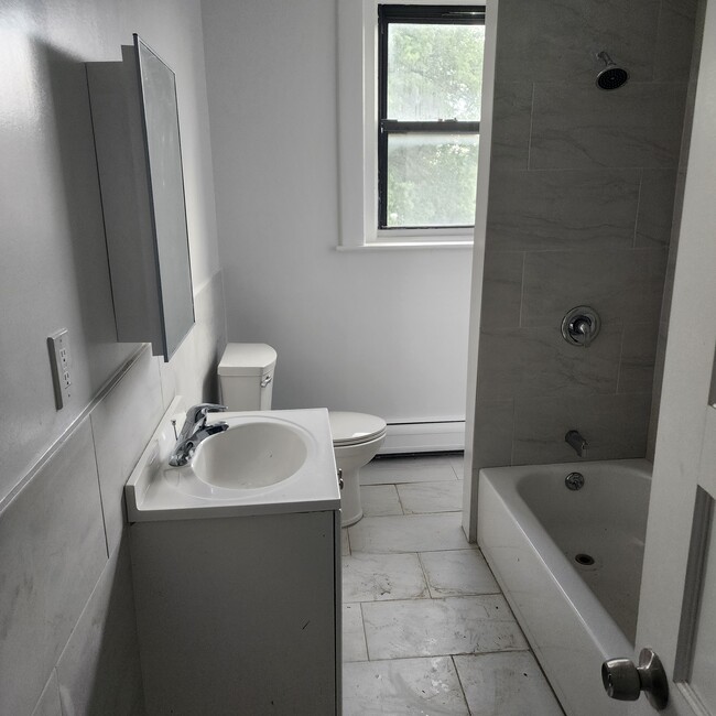 All tile bath. - 347 Park Ave