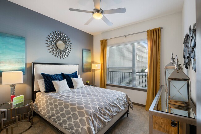 Spacious Bedroom with Large Window - VV&M Apartments