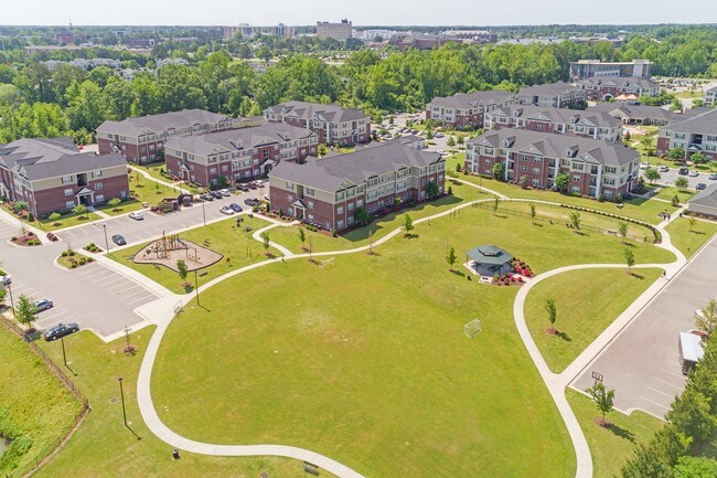 Community Park with Playground, Dog Park, and Walking Trail - The Heritage at Arlington Apartment Homes