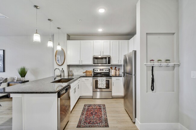 Our gourmet kitchens feature stainless steel appliances. - Windsor Ridge Apartments