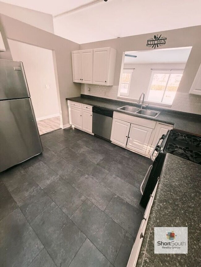 Photo - Lansing 4 bed 2 bath single family home with fenced in back yard.