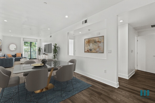 Open-Concept Dining and Living Room with Patio