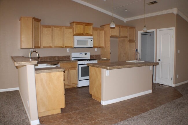 Photo - Charming 3-Bedroom Home with Fireplace, Spacious Backyard & Attached Garage in California City!