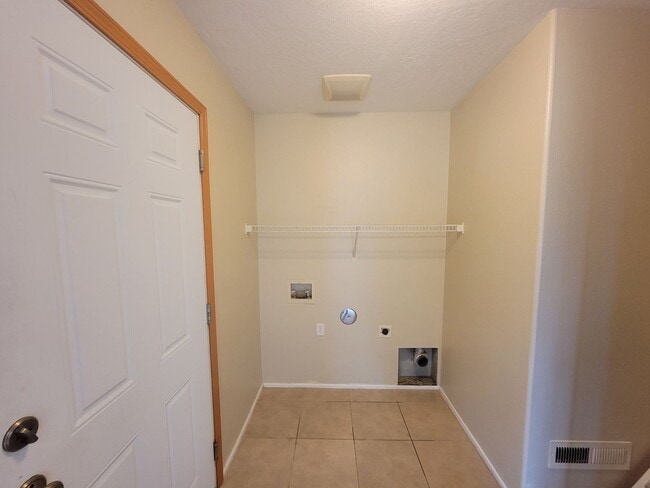 Photo - Comfortable 4-Bedroom Home with Fenced Bac...