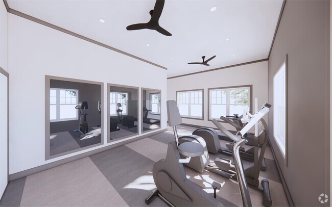 Maintain your wellness routine with on-site cardio and weight equipment. - The Mark Townhomes