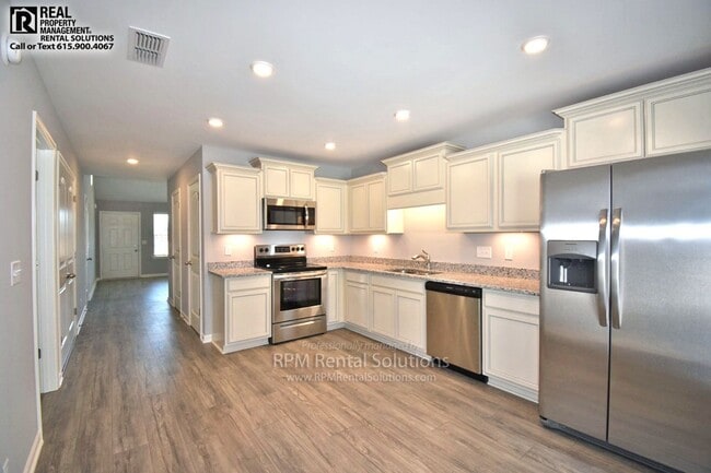 Photo - Beautiful 3BR/2.5BA+Bonus luxury townhome! Attached garage AND washer/dryer included!
