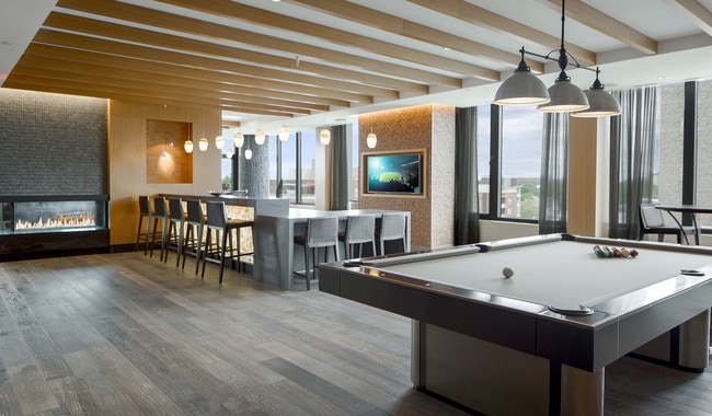 Connect, relax, and play in our stylish club room. A hub of community and comfort - Flats 8300