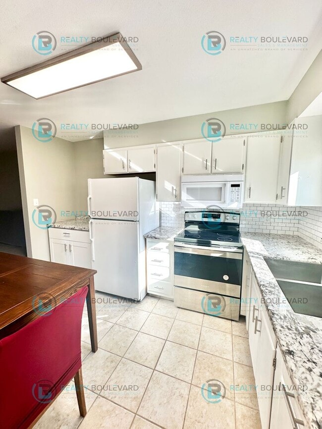 Photo - 2-bed, 2-bath, 2-story townhome with pool and park like setting outside the front door.