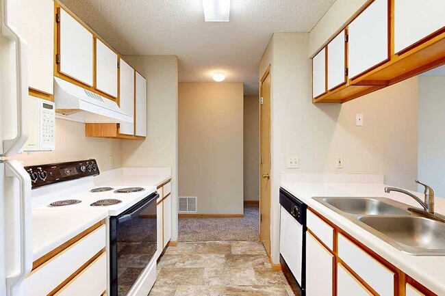 Efficient galley kitchens keep everything within easy reach to make meal prep and cleanup flow smoothly.