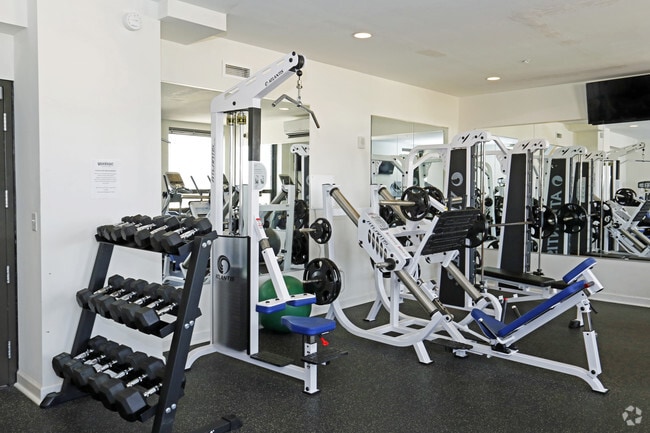 Free weights and weight training equipment in the 24-7 resident fitness center