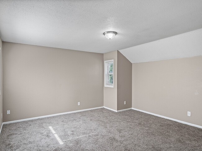 Bedroom with Window and Overhead Light