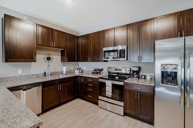 Cook with style in a kitchen that offers plenty of counter space in our 2-bedroom Magnolia.