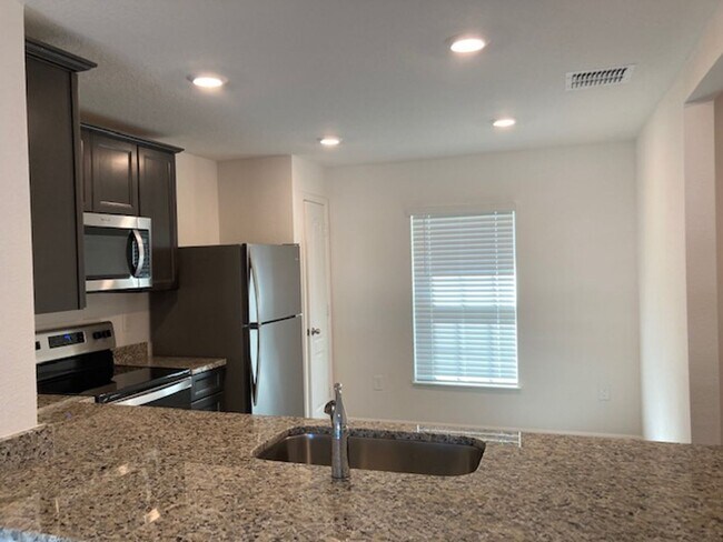 Photo - Like New 3/2/2 house with a screened in porch.