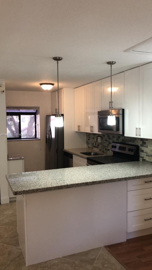 Building Photo - 104 Gardens Dr Unit 203