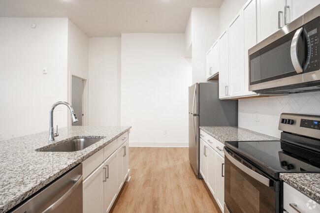 3BR, 2BA - 1,403SF - Kitchen - The Quincy Apartments