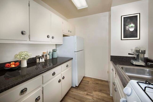 Galley-style kitchen at Flower Branch Apartments in Silver Spring, MD