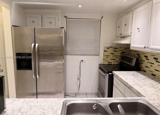 Building Photo - 1035 W 77th St Unit 211