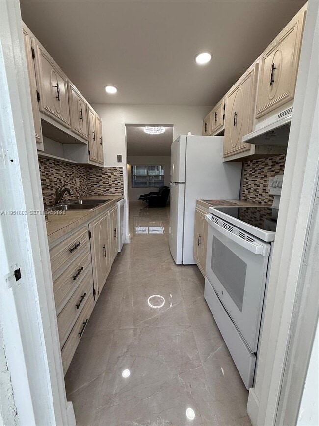 Building Photo - 6650 Royal Palm Blvd Unit 110C