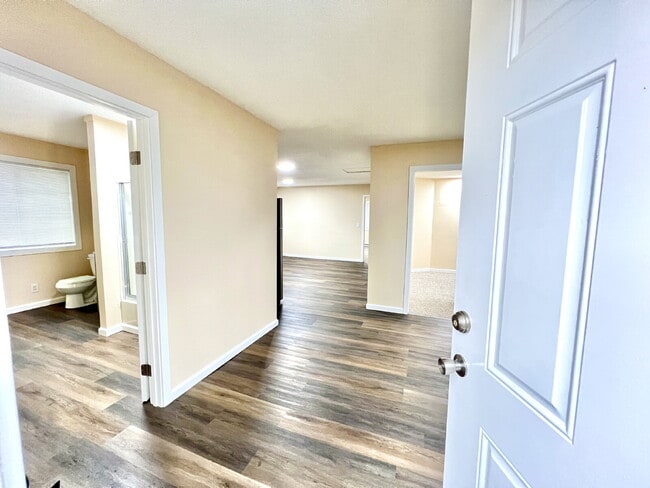 Photo - Elevated 3-Bedroom Home with Secure Garage & Cozy Living Space Unit C