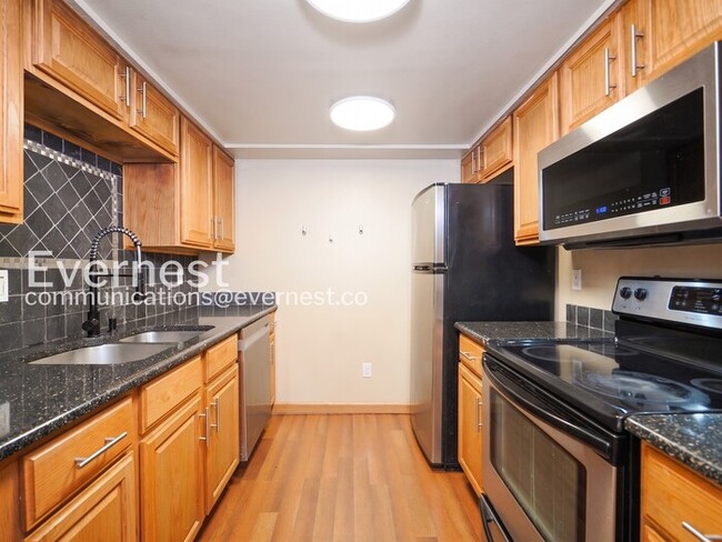 Photo - 2 Bed/2 Bath Condo with Fireplace & Garage / Vouchers Accepted / Available Now!