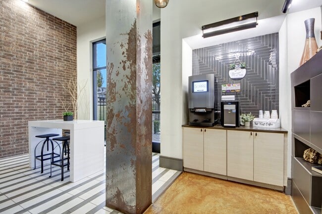 A lobby with a coffee bar and seating