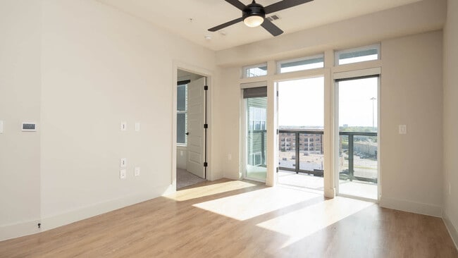 Living Room with Balcony and Hard Surface Flooring