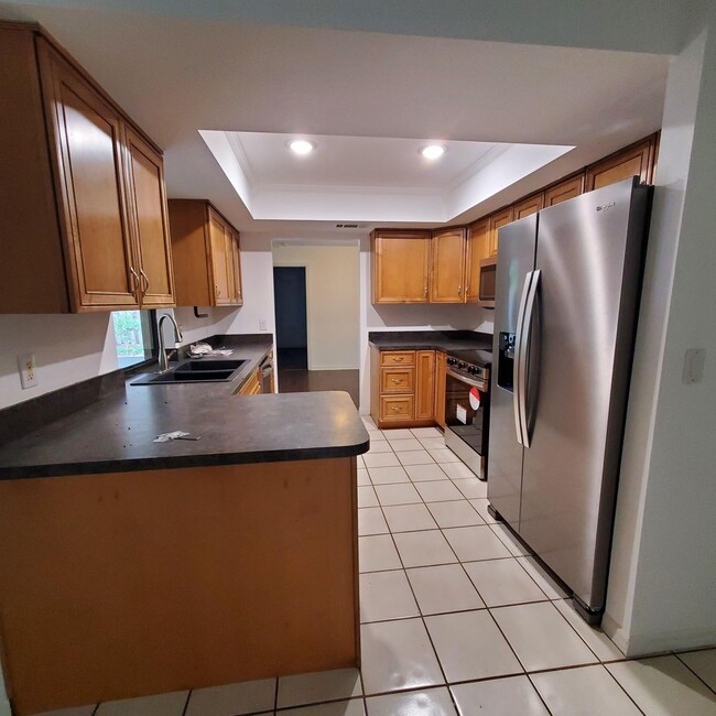 Photo - Location, convenience, comfort. This 4 bedroom plus den, 2 bath has it all!