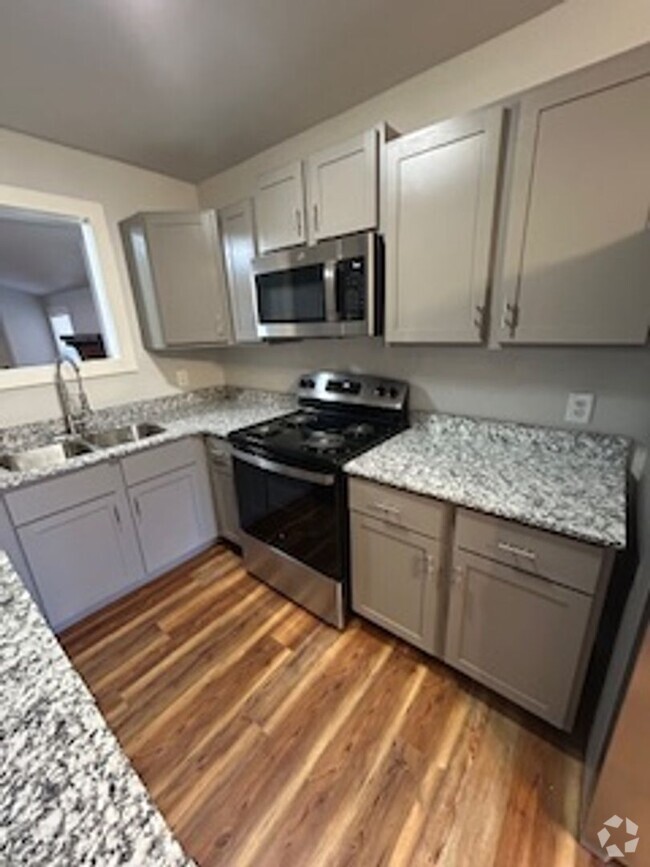 Building Photo - Updated Four Bedroom/Two Bath/Two Car Carp... Rental